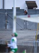 16 May 2021; A spectator watches on from outside the ground as Limerick goalkeeper watches a Galway shot approach his goal during the Allianz Hurling League Division 1 Group A Round 2 match between Galway and Limerick at Pearse Stadium in Galway. Photo by Piaras Ó Mídheach/Sportsfile