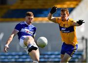 16 May 2021; Evan O'Carroll of Laois in action against Pearse Lillis of Clare during the Allianz Football League Division 2 South Round 1 match between Clare and Laois at Cusack Park in Ennis, Clare. Photo by Ray McManus/Sportsfile