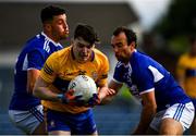 16 May 2021; Gavin Cooney of Clare is tackled by Laois players Robert Pigott and Gareth Dillon during the Allianz Football League Division 2 South Round 1 match between Clare and Laois at Cusack Park in Ennis, Clare. Photo by Ray McManus/Sportsfile
