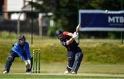 16 May 2021; Jeremy Lawlor of Northern Knights hits a six watched by Leinster Lightning wicketkeeper Lorcan Tucker during the Cricket Ireland Inter-Provincial Cup 2021 match between Northern Knights and Leinster Lightning at North Down Cricket Club in Comber, Down. Photo by Sam Barnes/Sportsfile