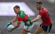 15 May 2021; Michael Plunkett of Mayo in action against Liam Middleton of Down during the Allianz Football League Division 2 North Round 1 match between Mayo and Down at Elverys MacHale Park in Castlebar, Mayo. Photo by Piaras Ó Mídheach/Sportsfile