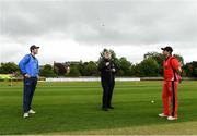 20 May 2021; Match referee Kevin Gallagher tosses the coin, watched by captains George Dockrell of Leinster Lightning and Tyrone Kane of Munster Reds, before the Cricket Ireland InterProvincial Cup 2021 match between Leinster Lightning and Munster Reds at Pembroke Cricket Club in Dublin. Photo by Matt Browne/Sportsfile