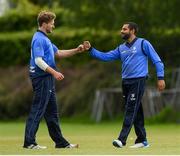 20 May 2021; Simi Singh of Leinster Lightning is congratulated by Barry McCarthy after making a catch to dismiss Seamus Lynch of Munster Reds during the Cricket Ireland InterProvincial Cup 2021 match between Leinster Lightning and Munster Reds at Pembroke Cricket Club in Dublin. Photo by Matt Browne/Sportsfile