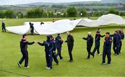 21 May 2021; Officials and Players from both sides bump fists after match is abandoned following the Cricket Ireland InterProvincial Cup 2021 match between North West Warriors and Northern Knights at Bready Cricket Club in Magheramason, Tyrone. Photo by Sam Barnes/Sportsfile