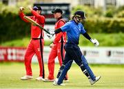 22 May 2021; Jamie Grassi of Leinster Lighting walks after being caught out by Seamus Lynch of Munster Reds during the Cricket Ireland InterProvincial Cup 2021 match between Munster Reds and Leinster Lightning at Pembroke Cricket Club in Dublin. Photo by Harry Murphy/Sportsfile