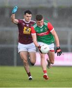 22 May 2021; Fionn McDonagh of Mayo is tackled by David Lynch of Westmeath during the Allianz Football League Division 2 North Round 2 match between Westmeath and Mayo at TEG Cusack Park in Mullingar, Westmeath. Photo by Stephen McCarthy/Sportsfile