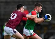 22 May 2021; Jordan Flynn of Mayo in action against David Lynch of Westmeath during the Allianz Football League Division 2 North Round 2 match between Westmeath and Mayo at TEG Cusack Park in Mullingar, Westmeath. Photo by Stephen McCarthy/Sportsfile