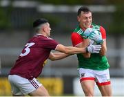22 May 2021; Michael Plunkett of Mayo in action against Kevin Maguire of Westmeath during the Allianz Football League Division 2 North Round 2 match between Westmeath and Mayo at TEG Cusack Park in Mullingar, Westmeath. Photo by Stephen McCarthy/Sportsfile