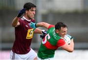 22 May 2021; Michael Plunkett of Mayo in action against Denis Corroon of Westmeath during the Allianz Football League Division 2 North Round 2 match between Westmeath and Mayo at TEG Cusack Park in Mullingar, Westmeath. Photo by Stephen McCarthy/Sportsfile