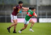 22 May 2021; Michael Plunkett of Mayo in action against Denis Corroon of Westmeath during the Allianz Football League Division 2 North Round 2 match between Westmeath and Mayo at TEG Cusack Park in Mullingar, Westmeath. Photo by Stephen McCarthy/Sportsfile