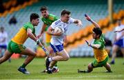 22 May 2021; Conor McCarthy of Monaghan gets past Donegal players, from left, Brendan McCole, Daire Ó Baoill, and Ryan McHugh on his way to score his side's third goal, and his hat-trick, during the Allianz Football League Division 1 North Round 2 match between Donegal and Monaghan at MacCumhaill Park in Ballybofey, Donegal. Photo by Piaras Ó Mídheach/Sportsfile