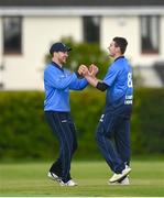 22 May 2021; Josh Little of Leinster Lighting, right, celebrates with team-mate Barry McCarthy after bowling the wicket of Murray Commins of Munster Reds during the Cricket Ireland InterProvincial Cup 2021 match between Munster Reds and Leinster Lightning at Pembroke Cricket Club in Dublin. Photo by Harry Murphy/Sportsfile