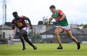 22 May 2021; Tommy Conroy of Mayo in action against Boidu Sayeh of Westmeath during the Allianz Football League Division 2 North Round 2 match between Westmeath and Mayo at TEG Cusack Park in Mullingar, Westmeath. Photo by Stephen McCarthy/Sportsfile