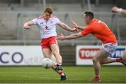22 May 2021; Peter Harte of Tyrone shoots to score his side's first goal despite the attention of Ciaron O'Hanlon of Armagh during the Allianz Football League Division 1 North Round 2 match between Armagh and Tyrone at Athletic Grounds in Armagh. Photo by Ramsey Cardy/Sportsfile