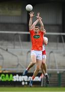 22 May 2021; Oisin O'Neill of Armagh in action against Pádraig Hampsey of Tyrone during the Allianz Football League Division 1 North Round 2 match between Armagh and Tyrone at Athletic Grounds in Armagh. Photo by Ramsey Cardy/Sportsfile