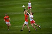 22 May 2021; Paul Hughes of Armagh in action against Kieran McGeary of Tyrone during the Allianz Football League Division 1 North Round 2 match between Armagh and Tyrone at Athletic Grounds in Armagh. Photo by Ramsey Cardy/Sportsfile