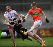 22 May 2021; Conor Trubitt of Armagh shoots to score his side's second goal past Tyrone goalkeeper Niall Morgan during the Allianz Football League Division 1 North Round 2 match between Armagh and Tyrone at Athletic Grounds in Armagh. Photo by Ramsey Cardy/Sportsfile