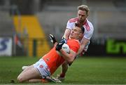 22 May 2021; Rian O'Neill of Armagh is fouled by Frank Burns of Tyrone, resulting in an Armagh penalty, during the Allianz Football League Division 1 North Round 2 match between Armagh and Tyrone at Athletic Grounds in Armagh. Photo by Ramsey Cardy/Sportsfile
