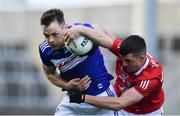 22 May 2021; John O’Loughlin of Laois in action against Dan Dineen of Cork during the Allianz Football League Division 2 South Round 2 match between Laois and Cork at MW Hire O'Moore Park in Portlaoise, Laois. Photo by Seb Daly/Sportsfile