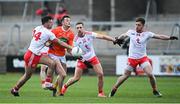 22 May 2021; Connaire Mackin of Armagh in action against Tyrone players, from left, Conor McKenna, Niall Sludden and Liam Rafferty, during the Allianz Football League Division 1 North Round 2 match between Armagh and Tyrone at Athletic Grounds in Armagh. Photo by Ramsey Cardy/Sportsfile