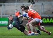 22 May 2021; Armagh goalkeeper Blaine Hughes, supported by Barry McCambridge, under pressure from Mark Bradley and Conor McKenna of Tyrone during the Allianz Football League Division 1 North Round 2 match between Armagh and Tyrone at Athletic Grounds in Armagh. Photo by Ramsey Cardy/Sportsfile