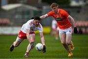 22 May 2021; Cormac Munroe of Tyrone in action against Conor Trubitt of Armagh during the Allianz Football League Division 1 North Round 2 match between Armagh and Tyrone at Athletic Grounds in Armagh. Photo by Ramsey Cardy/Sportsfile
