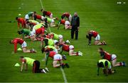 22 May 2021; Mayo head of strength & conditioning Conor Finn conducts pre-match stretching with Mayo players before the Allianz Football League Division 2 North Round 2 match between Westmeath and Mayo at TEG Cusack Park in Mullingar, Westmeath. Photo by Stephen McCarthy/Sportsfile