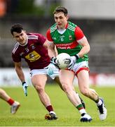 22 May 2021; Paddy Durcan of Mayo in action against David Lynch of Westmeath during the Allianz Football League Division 2 North Round 2 match between Westmeath and Mayo at TEG Cusack Park in Mullingar, Westmeath. Photo by Stephen McCarthy/Sportsfile