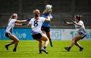 23 May 2021; Niamh Hetherton of Dublin gets a pass away as she is surrounded by the Waterford defence during the Lidl Ladies Football National League Division 1B Round 1 match between Dublin and Waterford at Parnell Park in Dublin. Photo by Ben McShane/Sportsfile