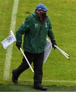 23 May 2021; A member of the grounds staff collects flags after the Allianz Football League Division 1 South Round 2 match between Dublin and Kerry at Semple Stadium in Thurles, Tipperary. Photo by Ray McManus/Sportsfile