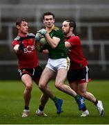 23 May 2021; Fionn Reilly of Meath in action against Caolan Mooney, left, and Corey Quinn of Down during the Allianz Football League Division 2 North Round 2 match between Down and Meath at Athletic Grounds in Armagh. Photo by David Fitzgerald/Sportsfile
