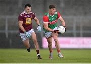 22 May 2021; Fionn McDonagh of Mayo in action against David Lynch of Westmeath during the Allianz Football League Division 2 North Round 2 match between Westmeath and Mayo at TEG Cusack Park in Mullingar, Westmeath. Photo by Stephen McCarthy/Sportsfile