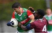 22 May 2021; Tommy Conroy of Mayo is tackled by Boidu Sayeh of Westmeath during the Allianz Football League Division 2 North Round 2 match between Westmeath and Mayo at TEG Cusack Park in Mullingar, Westmeath. Photo by Stephen McCarthy/Sportsfile