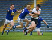 22 May 2021; Sean O'Connor of Tipperary breaks clear of Wicklow players Niall Donnolly, 6, Mark Kenny, 11, and Oisín Manning during the Allianz Football League Division 3 South Round 2 match between Tipperary and Wicklow at Semple Stadium in Thurles, Tipperary. Photo by Ray McManus/Sportsfile