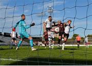 24 May 2021; Georgie Kelly of Bohemians heads to score his side's fourth goal, his third to complete his hat-trick, despite pressure from Dundalk players Andy Boyle, left, and Greg Sloggett, during the SSE Airtricity League Premier Division match between Bohemians and Dundalk at Dalymount Park in Dublin. Photo by Seb Daly/Sportsfile