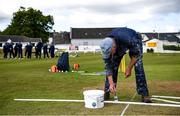 25 May 2021; Painter Ken Craig puts the finishing touches on the field before the Cricket Ireland InterProvincial Cup 2021 match between North West Warriors and Leinster Lightning at Eglinton Cricket Club in Derry. Photo by David Fitzgerald/Sportsfile