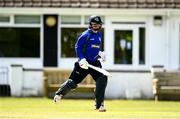25 May 2021; Andy McBrine of North West Warriors runs in for number 50 during the Cricket Ireland InterProvincial Cup 2021 match between North West Warriors and Leinster Lightning at Eglinton Cricket Club in Derry. Photo by David Fitzgerald/Sportsfile