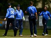 25 May 2021; Lorcan Tucker, second from left, of Leinster Lightning is congratulated by team-mates after catching out Shane Getkate of North West Warriors during the Cricket Ireland InterProvincial Cup 2021 match between North West Warriors and Leinster Lightning at Eglinton Cricket Club in Derry. Photo by David Fitzgerald/Sportsfile