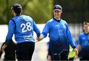 25 May 2021; Peter Chase of Leinster Lightning, left, is congratulated by team-mate George Dockrell after he caught out Andy McBrine of North West Warriors during the Cricket Ireland InterProvincial Cup 2021 match between North West Warriors and Leinster Lightning at Eglinton Cricket Club in Derry. Photo by David Fitzgerald/Sportsfile