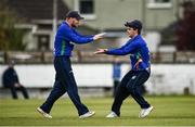 25 May 2021; Andy McBrine, right, of North West Warriors celebrates with team-mate Ross Allen after putting out Lorcan Tucker of Leinster Lightning during the Cricket Ireland InterProvincial Cup 2021 match between North West Warriors and Leinster Lightning at Eglinton Cricket Club in Derry. Photo by David Fitzgerald/Sportsfile