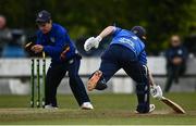 25 May 2021; Lorcan Tucker of Leinster Lightning fails to get back to the stumps in time as Andy McBrine of North West Warriors knocks the bails off the stumps during the Cricket Ireland InterProvincial Cup 2021 match between North West Warriors and Leinster Lightning at Eglinton Cricket Club in Derry. Photo by David Fitzgerald/Sportsfile