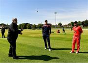 27 May 2021; Northern Knights captain Harry Tector, centre, and Munster Reds captain Tyrone Kane look on as match referee Kevin Gallagher tosses the coin before the Cricket Ireland InterProvincial Cup 2021 match between Munster Reds and Northern Knights at Pembroke Cricket Club in Dublin. Photo by Harry Murphy/Sportsfile