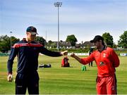 27 May 2021; Northern Knights captain Harry Tector, left, and Munster Reds captain Tyrone Kane fist bump before the Cricket Ireland InterProvincial Cup 2021 match between Munster Reds and Northern Knights at Pembroke Cricket Club in Dublin. Photo by Harry Murphy/Sportsfile