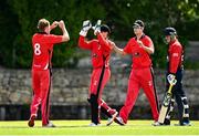 27 May 2021; Joshya Manley of Munster Reds, left, celebrates with team-mate PJ Moor after taking the wicket of James McCollum of Northern Knights during the Cricket Ireland InterProvincial Cup 2021 match between Munster Reds and Northern Knights at Pembroke Cricket Club in Dublin. Photo by Harry Murphy/Sportsfile