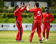 27 May 2021; Tyrone Kane of Munster Reds celebrates with team-mates after taking the wicket of Jeremy Lawlor of Northern Knights during the Cricket Ireland InterProvincial Cup 2021 match between Munster Reds and Northern Knights at Pembroke Cricket Club in Dublin. Photo by Harry Murphy/Sportsfile