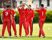 27 May 2021; Josh Manley of Munster Reds, centre, celebrates with team-mates after taking the wicket of Paul Stirling of Northern Knights during the Cricket Ireland InterProvincial Cup 2021 match between Munster Reds and Northern Knights at Pembroke Cricket Club in Dublin. Photo by Harry Murphy/Sportsfile