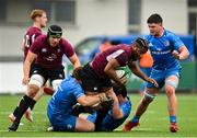 28 May 2021; Daniel Okeke of Ireland U20 is tackled by Mark Boyle, left, and John McKee of Leinster A during the match between Ireland U20 and Leinster A at Energia Park in Dublin. Photo by Ramsey Cardy/Sportsfile