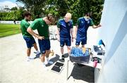 28 May 2021; Ryan Johansson has his weight checked following the session by sports scientist Adam Fox and physiotherapist Glauber Barduzzi, right, during a Republic of Ireland U21 training session in Marbella, Spain. Photo by Stephen McCarthy/Sportsfile