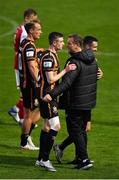 28 May 2021; Dundalk sporting director Jim Magilton celebrates with Daniel Kelly, left, and Michael Duffy following their side's victory over St Patrick's Athletic in the SSE Airtricity League Premier Division match between St Patrick's Athletic and Dundalk at Richmond Park in Dublin. Photo by Seb Daly/Sportsfile