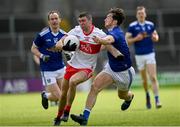 29 May 2021; Ciaran McFaul of Derry is tackled by Oisin Kiernan of Cavan during the Allianz Football League Division 3 North Round 3 match between Cavan and Derry at Kingspan Breffni in Cavan. Photo by Harry Murphy/Sportsfile